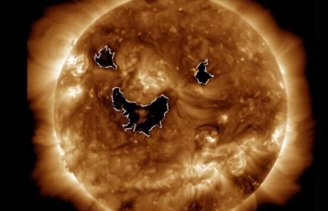 Photo from NASA satellite shows the sun was 'smiling' this week